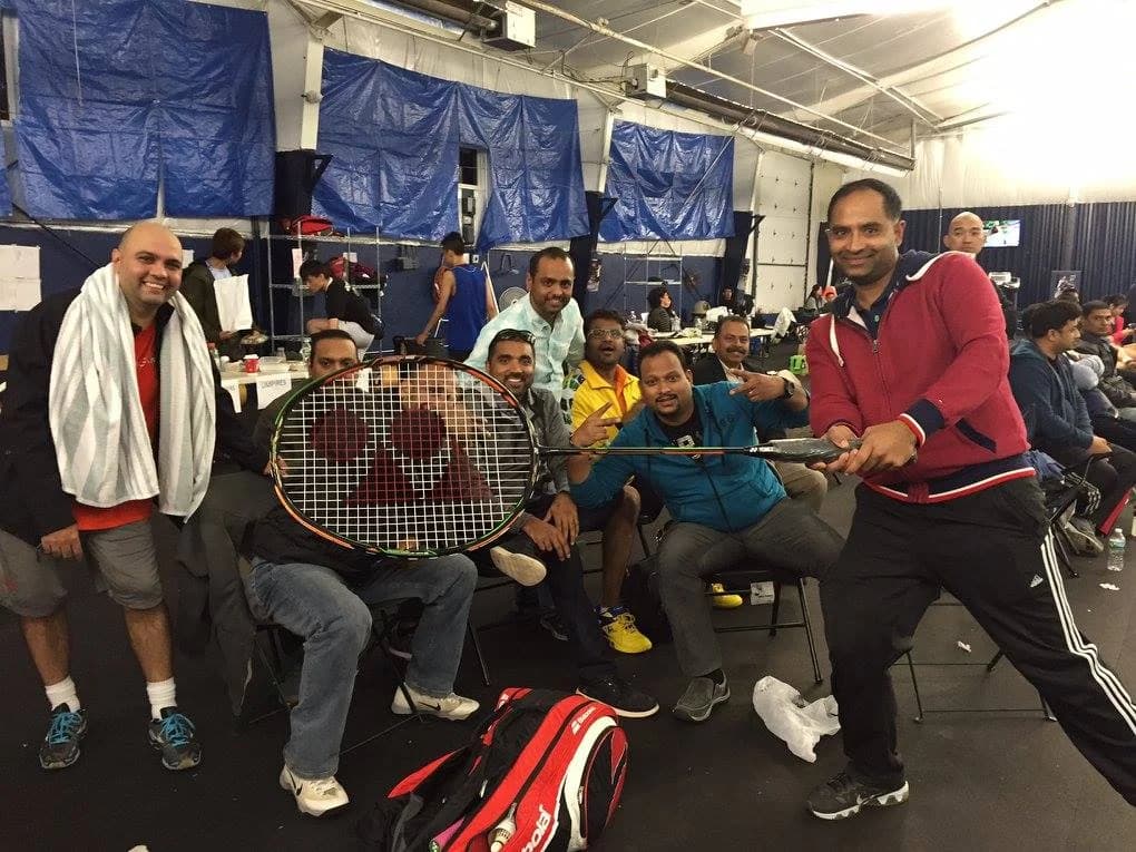 Badminton players relaxing together